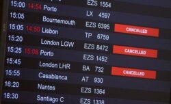 Flights from Britain are announced canceled at Cointrin airport, the day the Swiss government imposed a 10-day quarantine for travelers who have entered from Britain, during the outbreak of the COVID-19 in Geneva, Switzerland, Dec. 21, 2020.