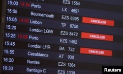 Flights from Britain are announced canceled at Cointrin airport, the day the Swiss government imposed a 10-day quarantine for travelers who have entered from Britain, during the outbreak of the COVID-19 in Geneva, Switzerland, Dec. 21, 2020.