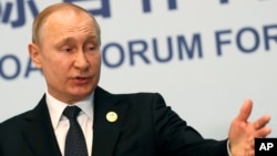 Russian President Vladimir Putin gestures while speaking to the media following the Belt and Road Forum in Beijing, China, April 27, 2019.