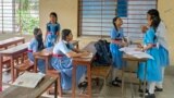 (FILE) School girls sit in a classroom, in Dhaka on August 7, 2024, after former prime minister Sheikh Hasina fled Bangladesh.
