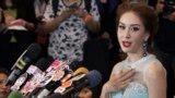 Miss Universe Thailand Weluree Ditsayabut speaks during a news conference at Renaissance Hotel in Bangkok. Ditsayabut renounced her title over remarks she made on social media including one that &quot;red shirt&quot; activists, supporters of ousted prime minister Yingluck Shinawatra, should all be executed.