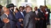 South Sudan President Salva Kiir, L, shakes hands with Pagan Amum leader of the Real-SPLM group, during the launch of peace talks in Nairobi, Kenya, May 9, 2024.