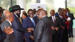 South Sudanese President Salva Kiir Mayardit, left, shakes hands with Pagan Amum Okiech, leader of the Real-SPLM group, during the launch of high-level peace talks for South Sudan at State House in Nairobi, Kenya, on Thursday, May 9, 2024. 