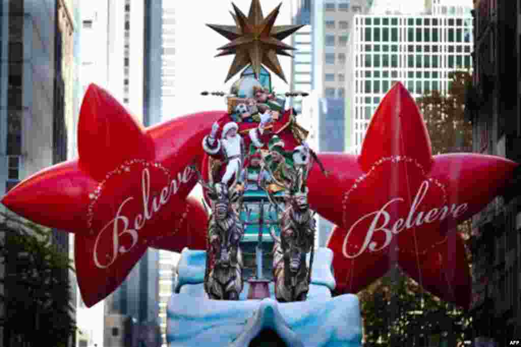 Santa Claus waves at spectators during the Macy's Thanksgiving Day Parade, Thursday, Nov. 24, 2011, in New York. A jetpack-wearing monkey and a freakish creation from filmmaker Tim Burton are two of the big new balloons that will make their inaugural appe