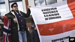 Protester hold banners as people from anti-Islamic groups from all over Europe came together March 31, 2012 in Aarhus, Denmark. 