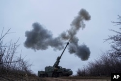 A Ukrainian self-propelled howitzer brigade fires toward Russian positions at the front line in the Donetsk region, Ukraine, on Jan. 23, 2025. Ukraine announced the mandatory evacuations of dozens of families from front-line villages in the region.