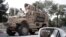 FILE - A U.S. armored vehicle patrols in Kabul, Afghanistan, Aug. 23, 2017.