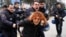 Riot police detain a demonstrator during a protest against the dismissal of academics from universities following a post-coup emergency decree, outside the Cebeci campus in Ankara, Turkey, Feb. 10, 2017. 