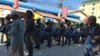 Police look on as mourners participate in a Buddhist ceremony, for the brutal government crackdown during two days of rioting in January 2014, on Sunday January 3rd, 2016. (Hul Reaksmey/VOA Khmer)