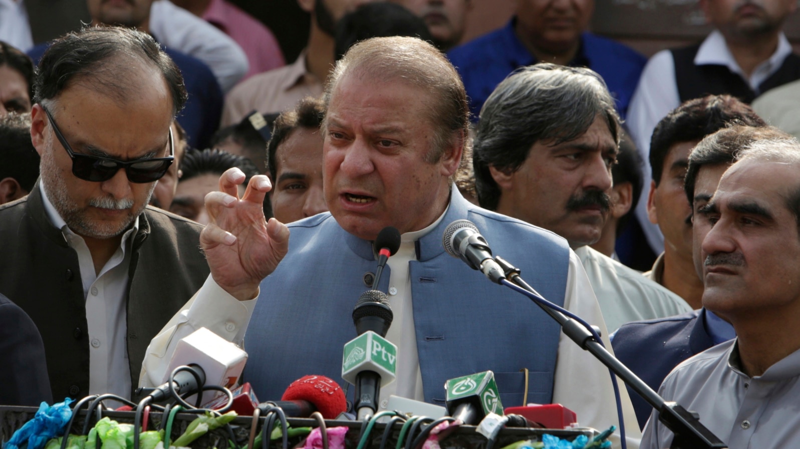 FILE - Nawaz Sharif addresses a crowd during his visit to a mausoleum of Pakistani poet Mohammad Iqbal on the occasion of Pakistan Independence Day in Lahore, Aug. 14, 2017.