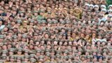 War veterans and commanding officers, who took part in a military parade held in celebration of the 60th anniversary of the signing of the truce of the Korean War, clap and cheer in an undisclosed location in this undated photo released by North Korea&#39;s Korean Central News Agency.