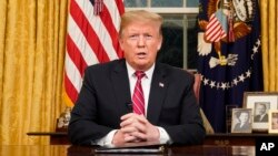 President Donald Trump speaks from the Oval Office of the White House.