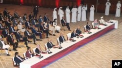 FILE - Abdullah Abdullah, center, chairman of Afghanistan's High Council for National Reconciliation, talks at the opening session of the peace talks between the Afghan government and the Taliban in Doha, Qatar, Saturday, Sept. 12, 2020. 