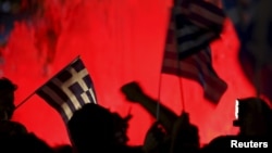 Greek national flags on the main Constitution (Syntagma) square in Athens, Greece July 5, 2015. 