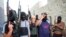 FILE - Masked Sunni gunmen pose during a patrol outside Fallujah, Iraq, April 28, 2014. 