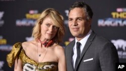 Sunrise Coigney, left, and Mark Ruffalo arrive at the world premiere of "Thor: Ragnarok" at the El Capitan Theatre, Oct. 10, 2017, in Los Angeles.