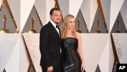 Leonardo DiCaprio, left, and Kate Winslet arrive at the Oscars on Feb. 28, 2016, at the Dolby Theatre in Los Angeles.