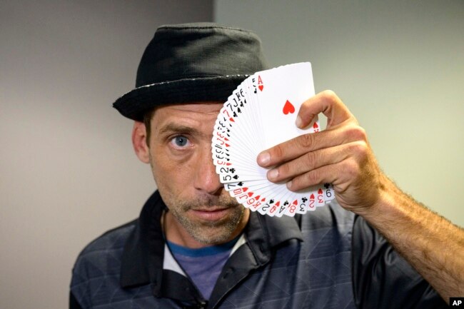 FILE - Paul Carpenter poses for a photo on Friday, Feb. 23, 2024. Carpenter says he was hired to use AI software to imitate President Joe Biden's voice to get New Hampshire Democrat voters not to vote in the state's presidential primary. (AP Photo/Matthew Hinton, File)