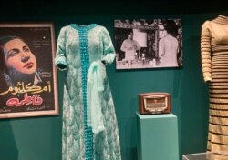 Dresses and photos of Egyptian star Oum Kalthoum, who like many of her peers came from a modest background. (Lisa Bryant/VOA)