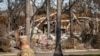 A members of the National Guard stands at a checkpoint as US President Donald Trump is set to tour wildfire damage in the Pacific Palisades neighborhood of Los Angeles, Jan. 24, 2025. 