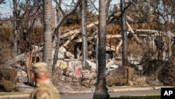 A members of the National Guard stands at a checkpoint as US President Donald Trump is set to tour wildfire damage in the Pacific Palisades neighborhood of Los Angeles, Jan. 24, 2025. 