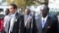 FILE - Botswana President Ian Khama (L) walks alongside Zimbabwe President Robert Mugabe (R) during a lunch break at the SADC summit in Maputo, June 15, 2013. 