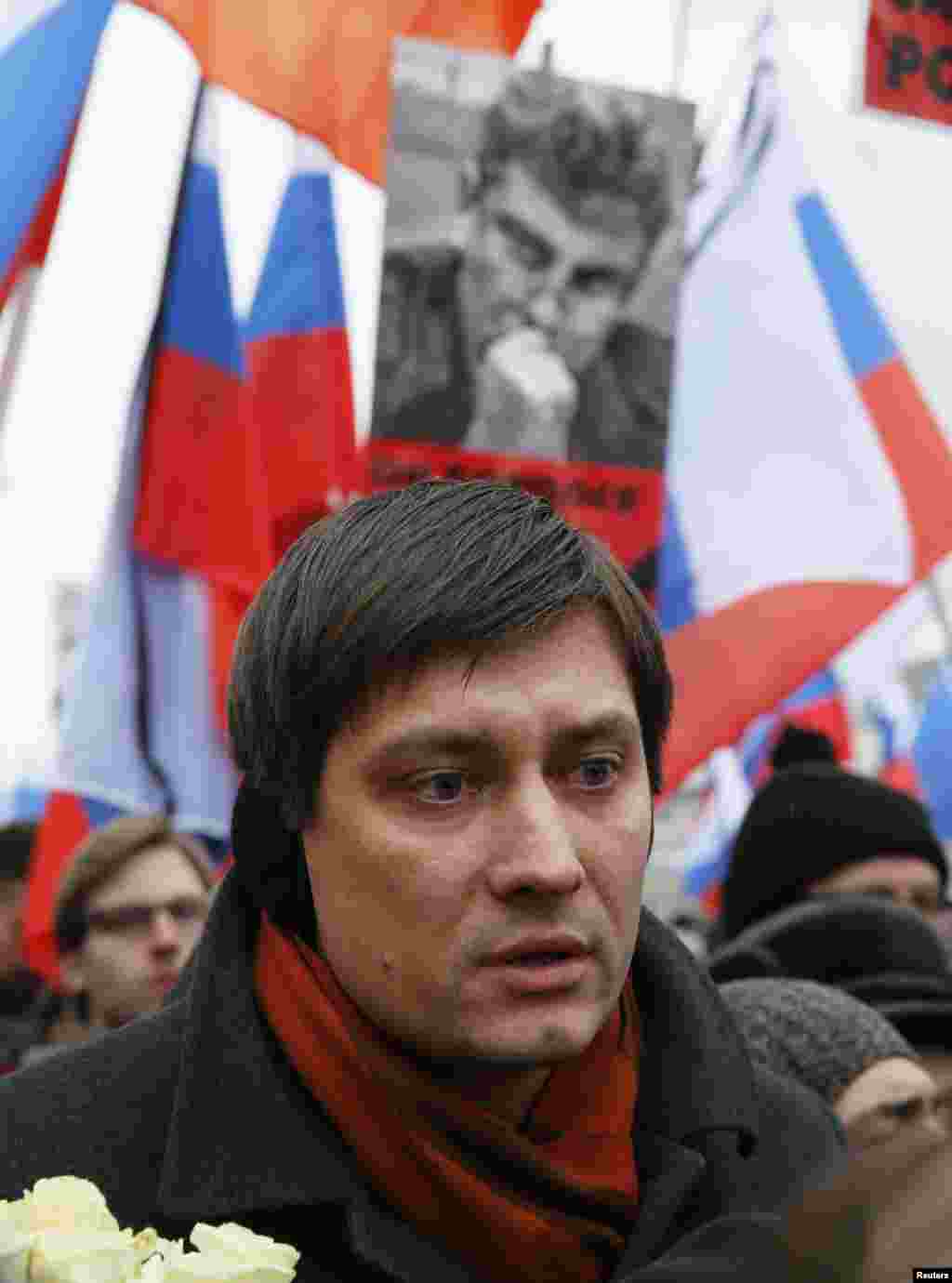 Dmitry Gudkov, a member of the Russian parliament, attends a march to commemorate Kremlin critic Boris Nemtsov, who was shot dead Friday, in Moscow, March 1, 2015. 