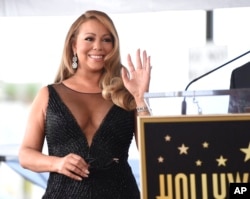 FILE - Mariah Carey attends a ceremony honoring her with a star on the Hollywood Walk of Fame in Los Angeles, Aug. 5, 2015.