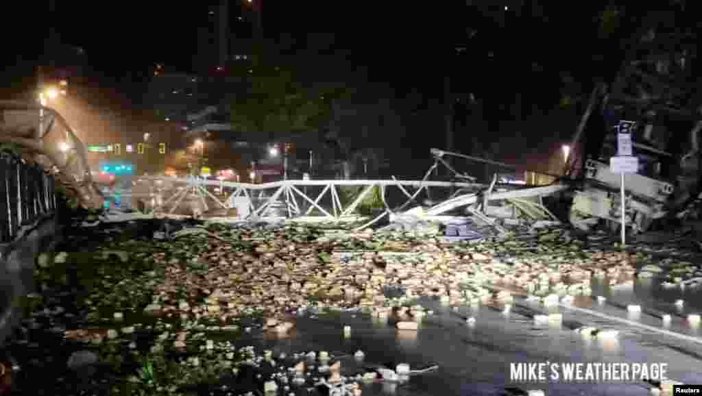 Debris is strewn on a street following the collapse of a crane, during heavy rainfall and strong winds caused by Hurricane Milton, in St. Petersburg, Florida, Oct. 9, 2024, in this screengrab taken from social media. (Mike's Weather Page/via Reuters)