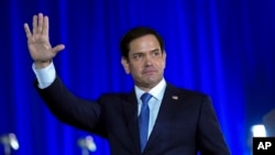 FILE - Senator Marco Rubio waves before Republican presidential candidate former President Donald Trump speaks at an event in West Palm Beach, Florida, June 14, 2024.