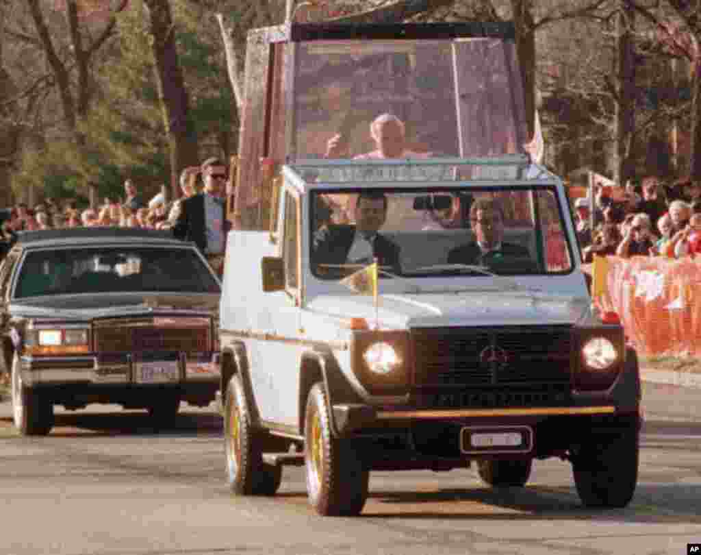 Pope John Paul II in the Popemobile in 1999 (AP Photo/Leon Algee)