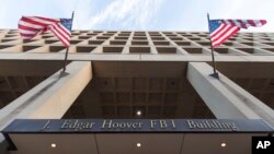 FILE - The Pennsylvania Avenue entrance of the J. Edgar Hoover Federal Bureau of Investigations (FBI) Building is seen in Washington, Nov. 30, 2017.