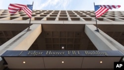 The Pennsylvania Avenue entrance of the J. Edgar Hoover Federal Bureau of Investigations (FBI) Building is seen in Washington, Nov. 30, 2017.