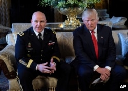 FILE - President Donald Trump listens as Army Lt. Gen. H.R. McMaster, now the president's national security adviser, talks at Trump's Mar-a-Lago estate in Palm Beach, Fla, Feb. 20, 2017.