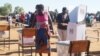 Malawians cast ballots May 21 in presidential and parliamentary elections. The results of the presidential vote must wait until about a third of the ballots are recounted.