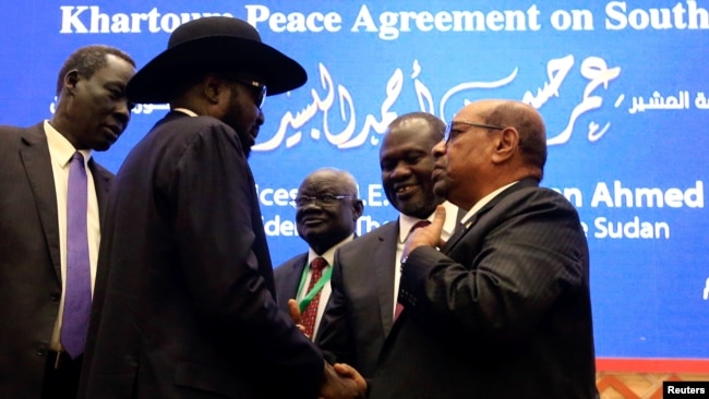 FILE - South Sudan President Salva Kiir, Sudan's President Omar al-Bashir and South Sudan rebel leader Riek Machar are seen after peace talks in Khartoum, Sudan, June 27, 2018.