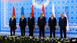 FILE - Leaders of the Shanghai Cooperation Organization pose for a photo during the group's summit in Dushanbe, Tajikistan, Sept. 12, 2014.