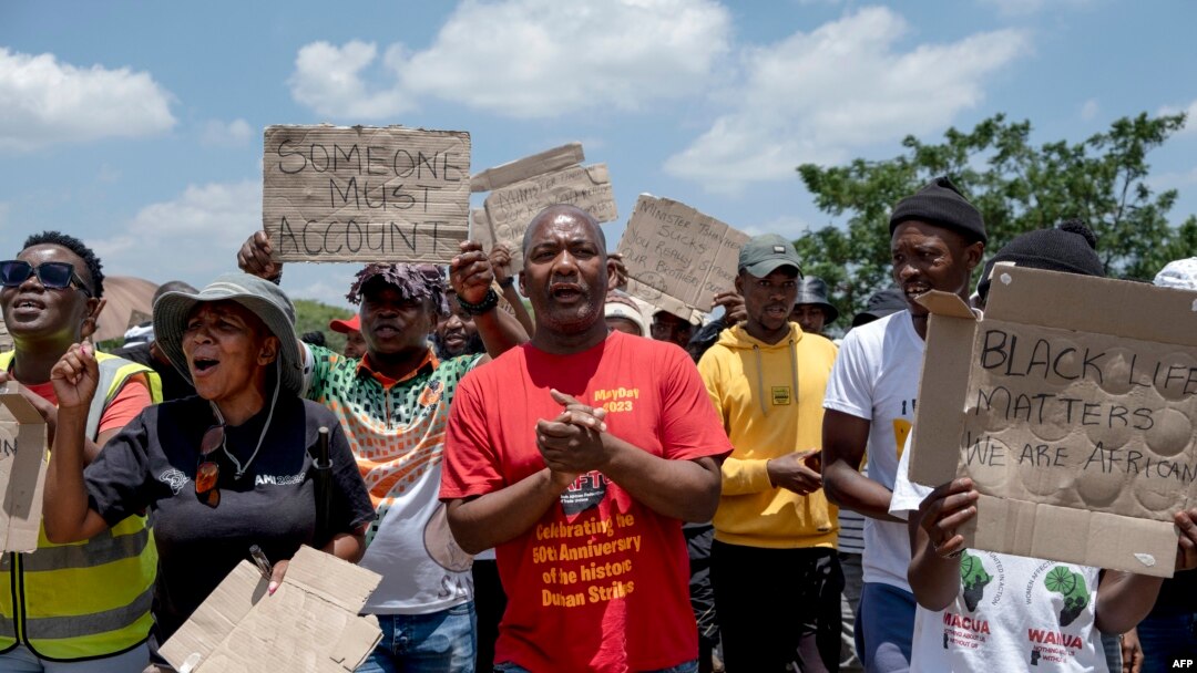 President of the General Industries Workers Union of South Africa Mametlwe Sebei, center, chants slogans while joining community members and workers in a protest during the rescue operation to retrieve illegal miners from an abandoned gold mine in South Africa on Jan. 14, 2024.