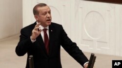 FILE - Turkey's President Recep Tayyip Erdogan addresses the parliament in Ankara, Turkey, Oct. 1, 2016.