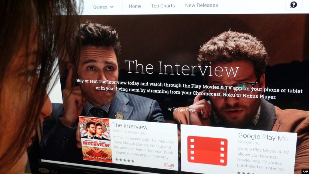 In this photo illustration, a woman looks at the Google Play purchase page for the Sony film 'The Interview,' in Washington, D.C., Dec. 24, 2014.