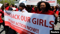 Protesters march in support of the girls kidnapped by members of Boko Haram in front of the Nigerian Embassy in Washington, D.C., May 6, 2014.