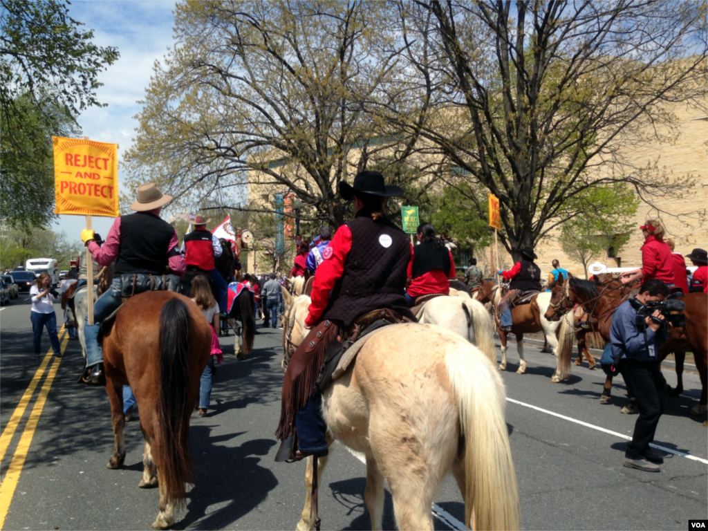 The Cowboy and Indian Alliance stages a &quot;Reject and Protect&quot; protest around Capitol Hill against the Keystone XL oil pipeline project, Washington D.C., April 22, 2014. (Diaa Bekheet/VOA)