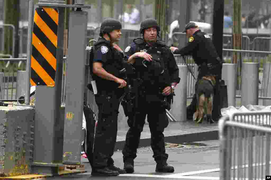 Heavily armed police officers stand guard outside the World Trade Center before President Obama&#39;s arrival for the dedication ceremony of the National September 11 Memorial Museum, New York City, May 15, 2014.