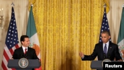 President Barack Obama and Mexican President Enrique Peña Nieto (L) speak at the White House in Washington, July 22, 2016. REUTERS/Joshua Roberts