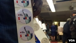 "I voted" stickers are given to people after turning in their ballots to election officials at the 2nd Canaan Baptist Church in Central Harlem, New York, April 19, 2016. (R. Taylor / VOA) 