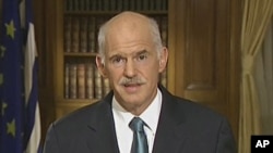 In this image taken from TV, Greek Prime Minister George Papandreou, talks to the nation in a live TV broadcast, June 15, 2011, in Athens