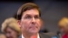 FILE - U.S. Secretary for Defense Mark Esper waits for the start of a meeting of NATO defense ministers at NATO headquarters in Brussels, Oct. 24, 2019. 