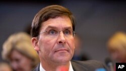 FILE - U.S. Secretary for Defense Mark Esper waits for the start of a meeting of NATO defense ministers at NATO headquarters in Brussels, Oct. 24, 2019. 