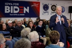 FILE - Democratic 2020 U.S. presidential candidate and former U.S. Vice President Joe Biden speaks during his campaign bus tour event in Oelwein, Iowa, Dec. 7, 2019.