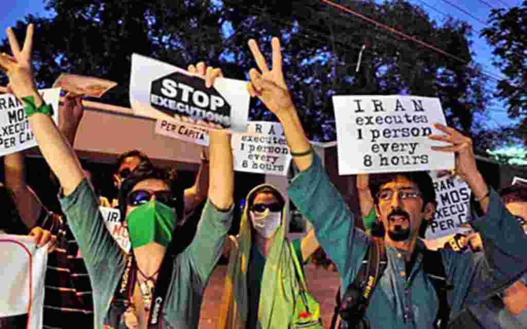 Thousands of defiant Iranian opposition supporters have staged what they said was a rally supporting Arab revolts as riot police armed with batons moved in to disperse them, February 14, 2011